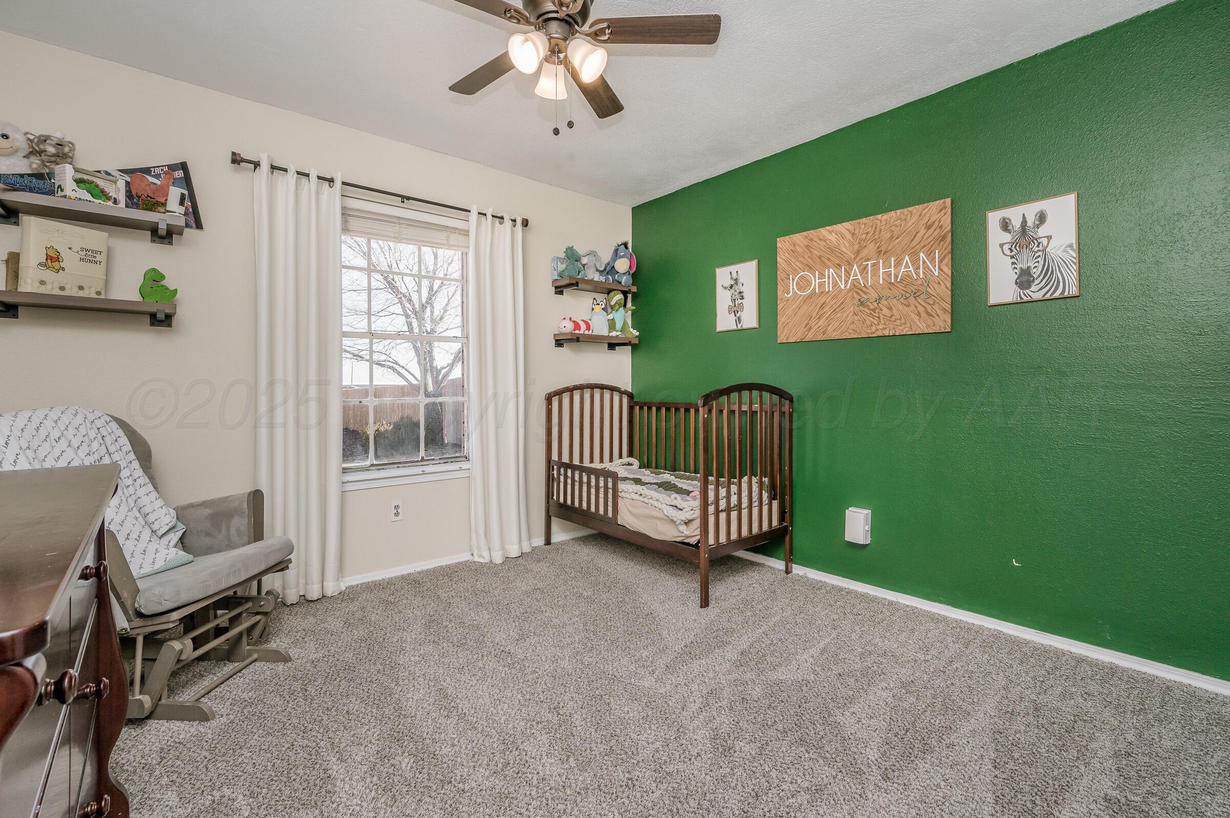 5336 Wheeler Lane Amarillo, TX 79110 - Photo 13 of 24 a living room with furniture and a window