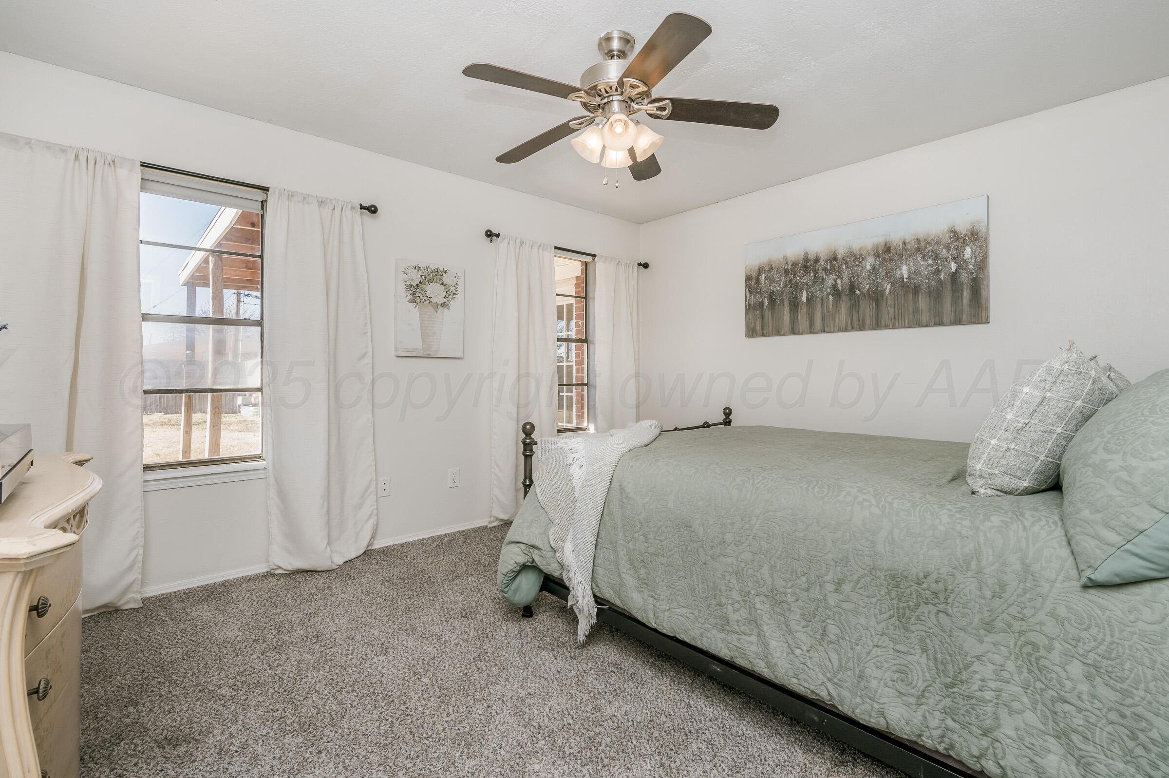 5336 Wheeler Lane Amarillo, TX 79110 - Photo 16 of 24 a bed room with a bed and a window