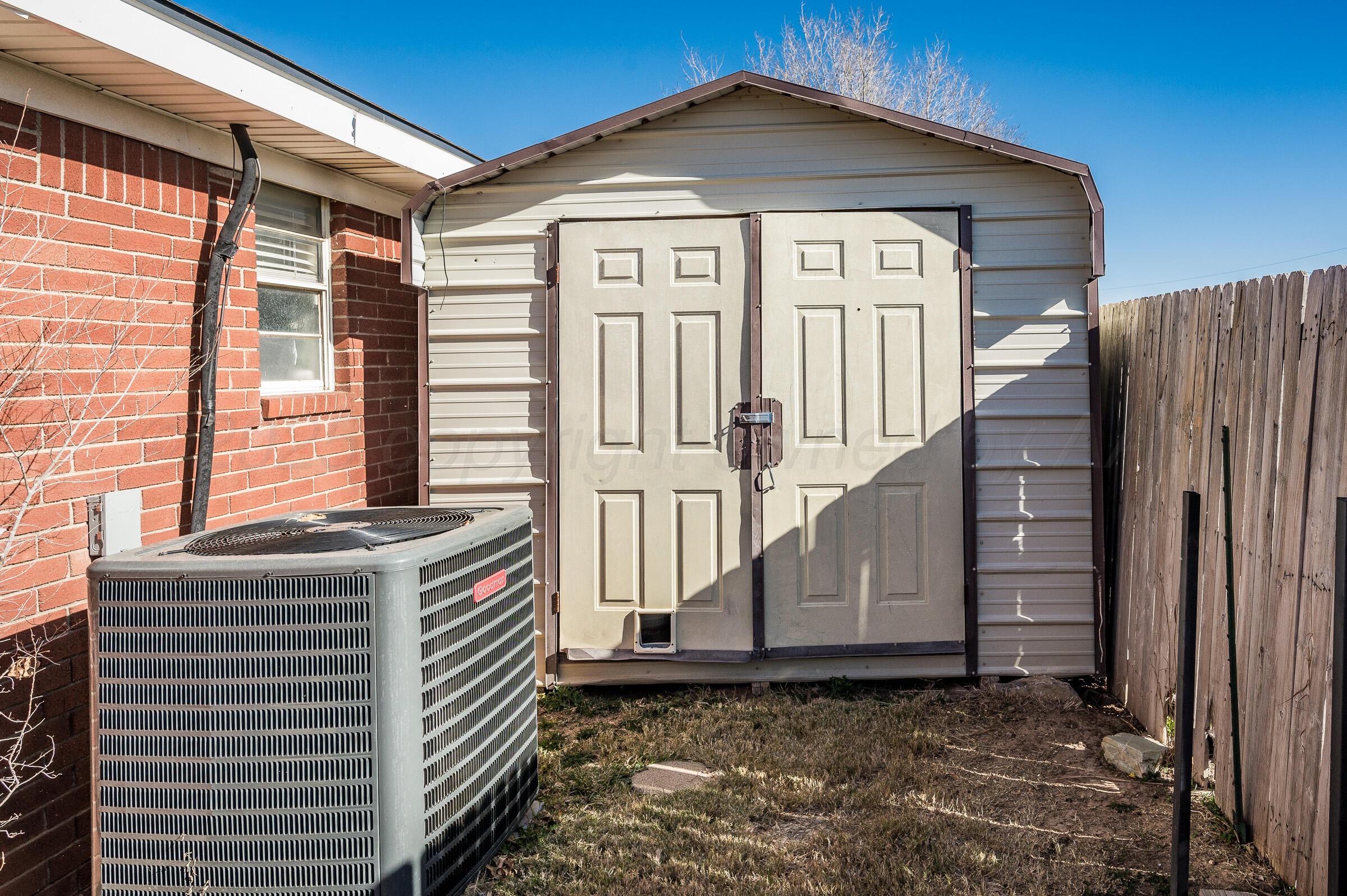 5336 Wheeler Lane Amarillo, TX 79110 - Photo 19 of 24 a front view of a house with wooden fence