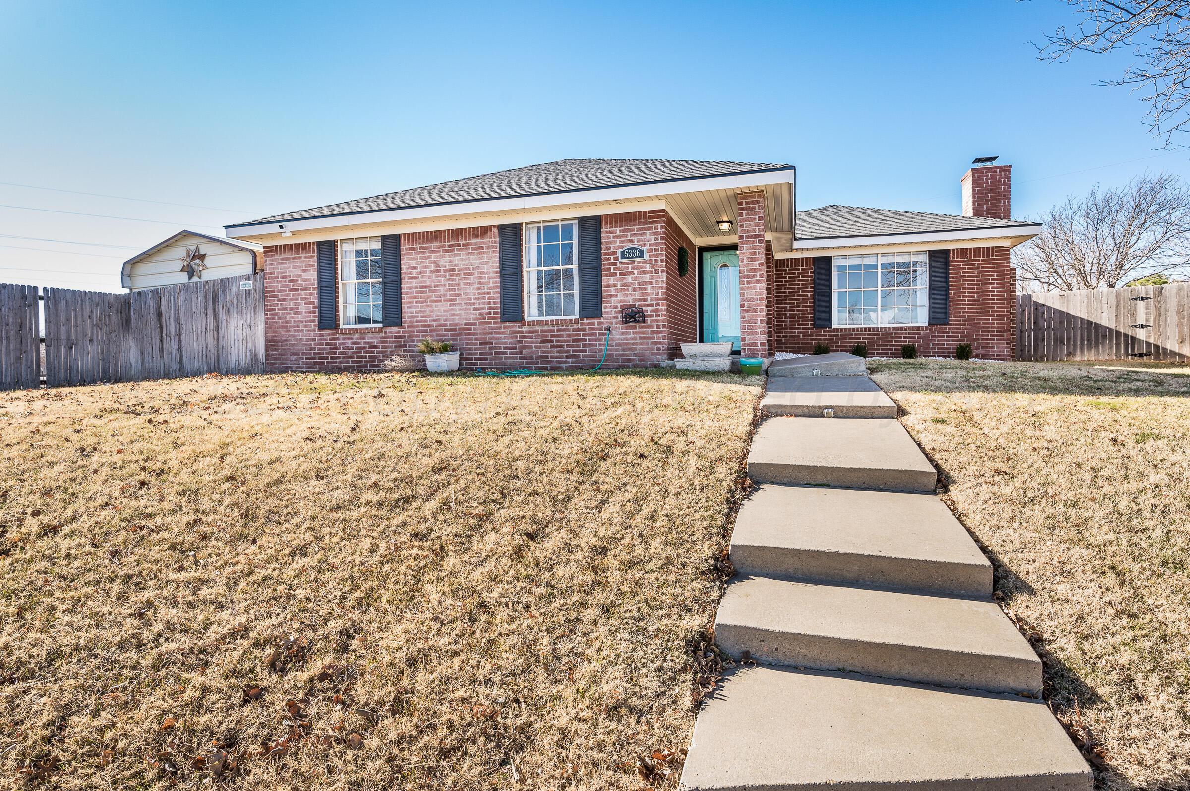 5336 Wheeler Lane Amarillo, TX 79110 - Photo 2 of 24 a front view of a house with a yard