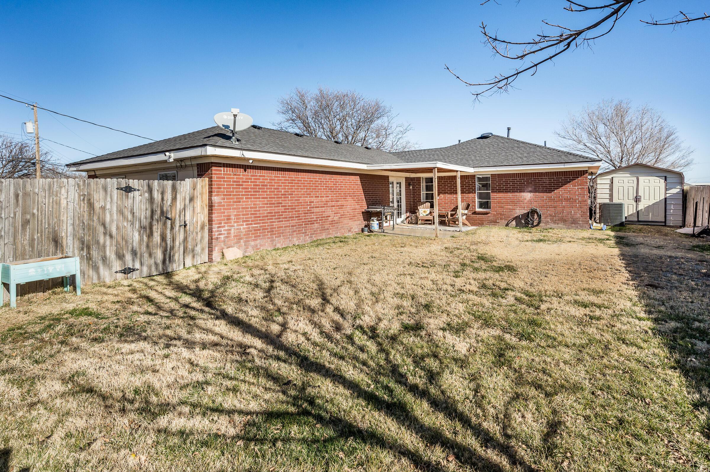 5336 Wheeler Lane Amarillo, TX 79110 - Photo 21 of 24 a front view of a house with a yard