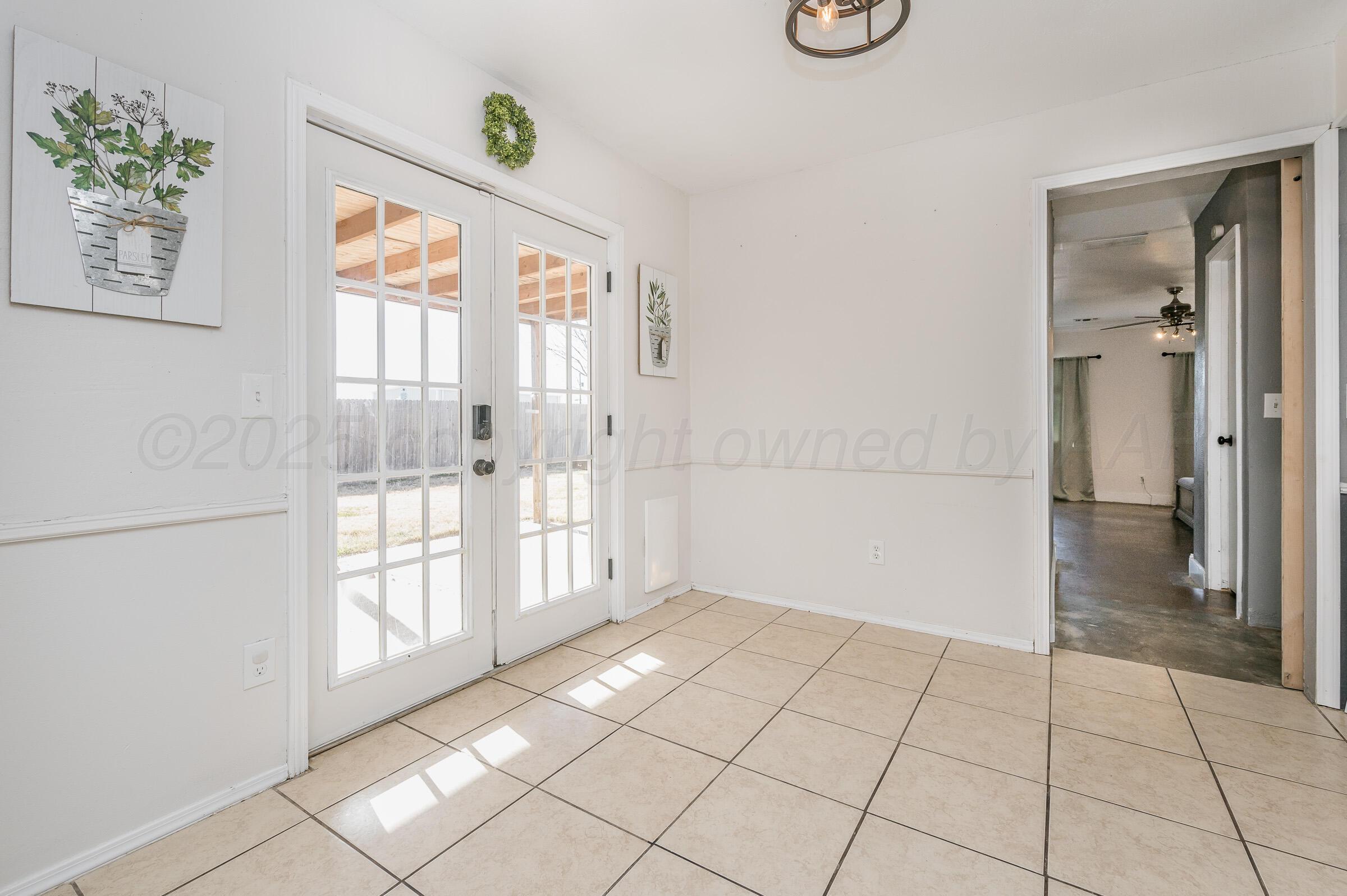5336 Wheeler Lane Amarillo, TX 79110 - Photo 6 of 24 a view of an entryway with wooden floor and door