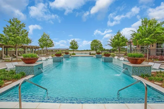 an aerial view of a house with a yard basket ball court and outdoor seating