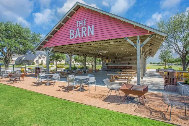 a view of a backyard with sitting area