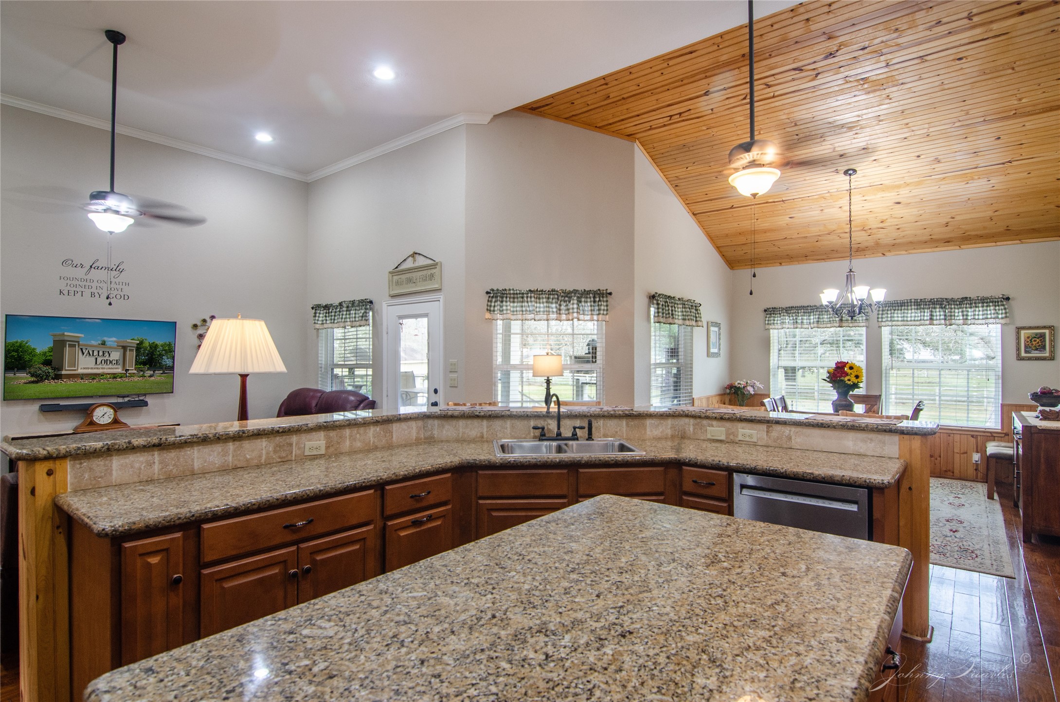 36606 Tejas Road Simonton, TX 77485 - Photo 15 of 32 a large kitchen with kitchen island a sink stainless steel appliances and a large window