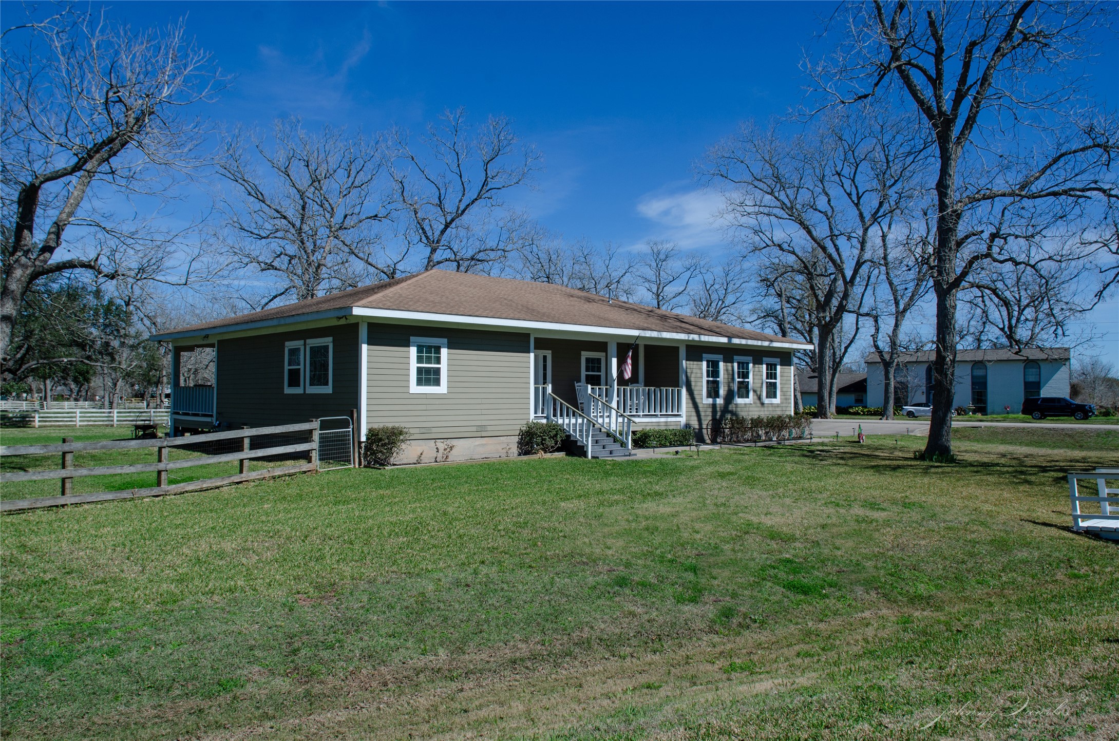 36606 Tejas Road Simonton, TX 77485 - Photo 2 of 32 a front view of a house with a garden