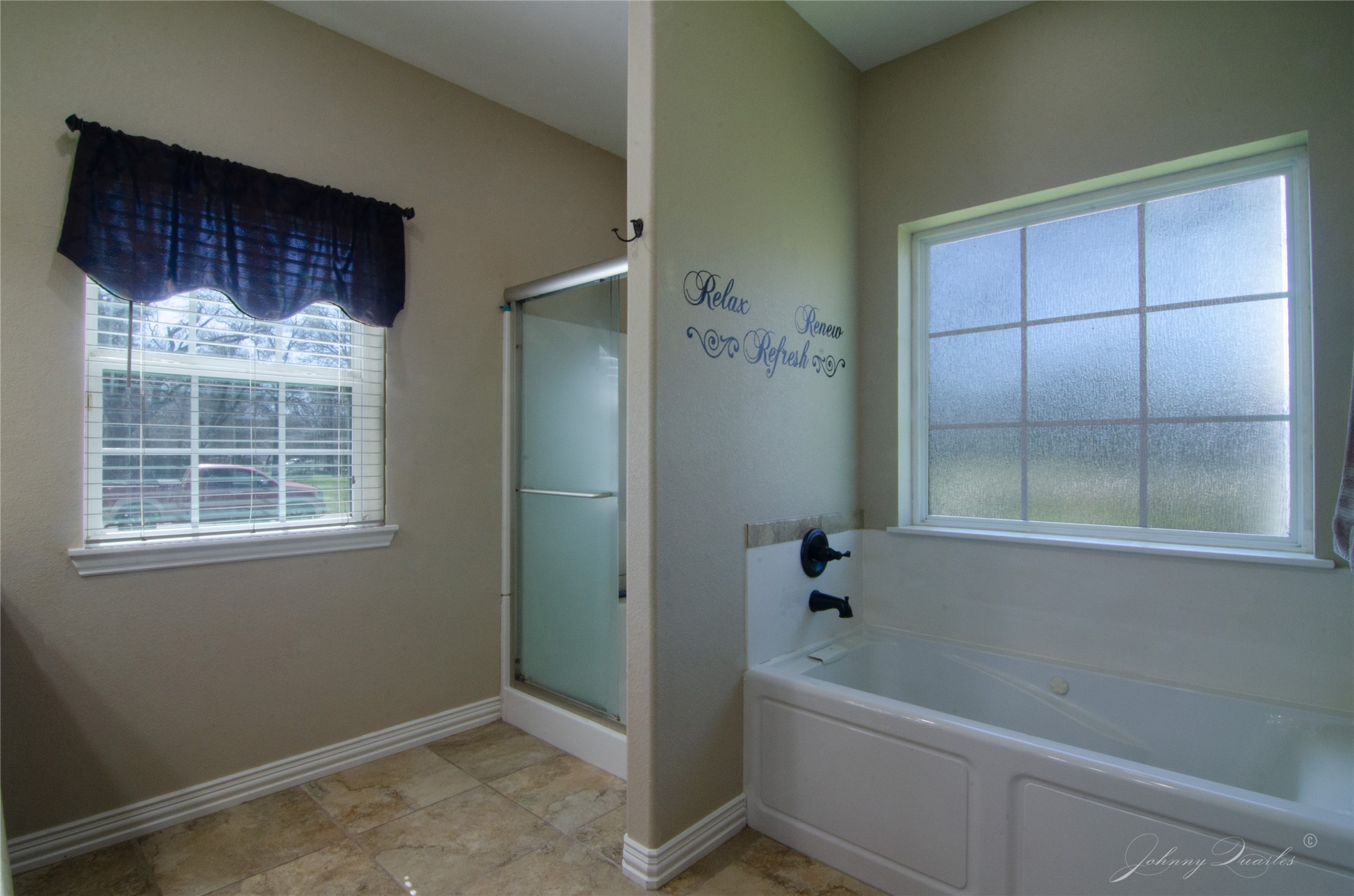 36606 Tejas Road Simonton, TX 77485 - Photo 23 of 32 a bathroom with a bathtub and a shower