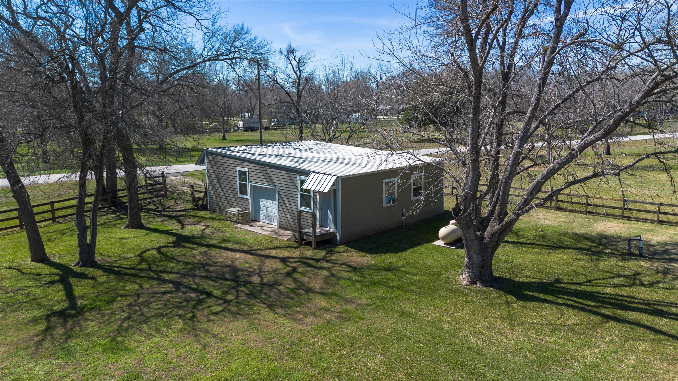 36606 Tejas Road Simonton, TX 77485 - Photo 27 of 32 a view of a house with a yard