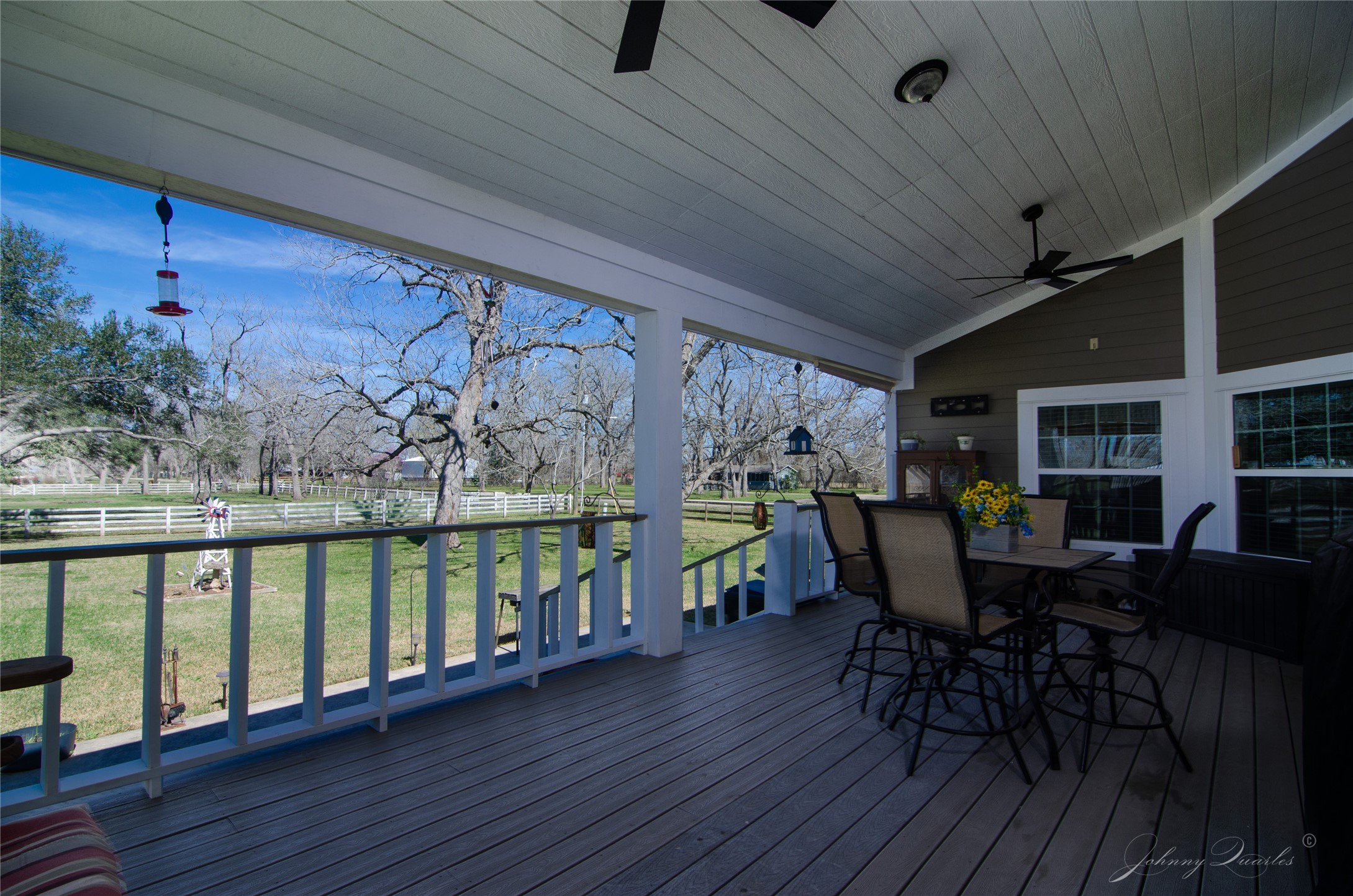 36606 Tejas Road Simonton, TX 77485 - Photo 8 of 32 a view of a porch with furniture and wooden floor