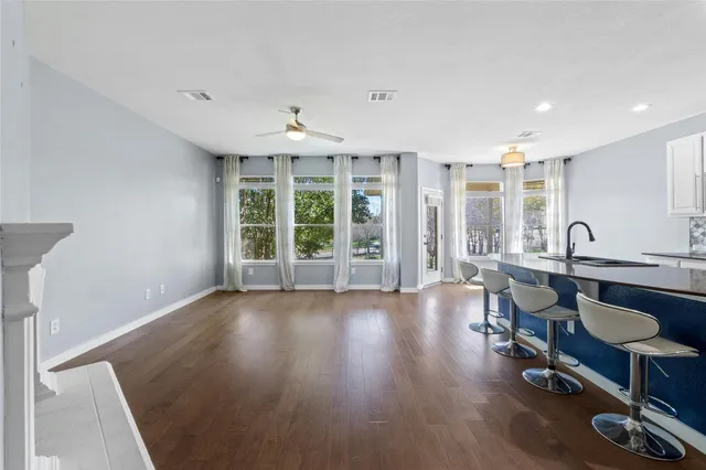 a view of a livingroom with furniture window and wooden floor