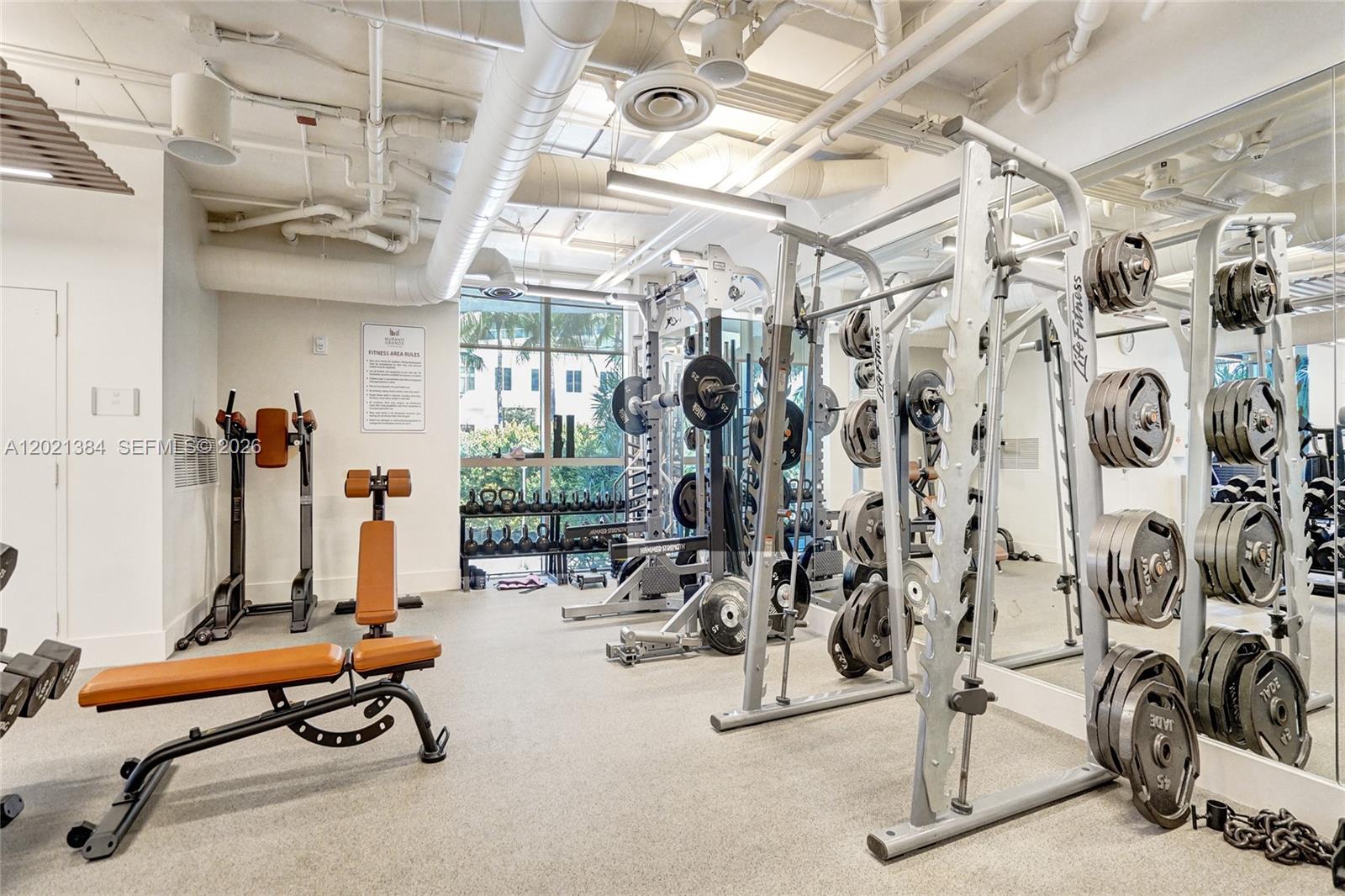 400 Alton Road, Unit PH11 Miami Beach, FL 33139 - Photo 46 of 49 a view of a room with gym equipment