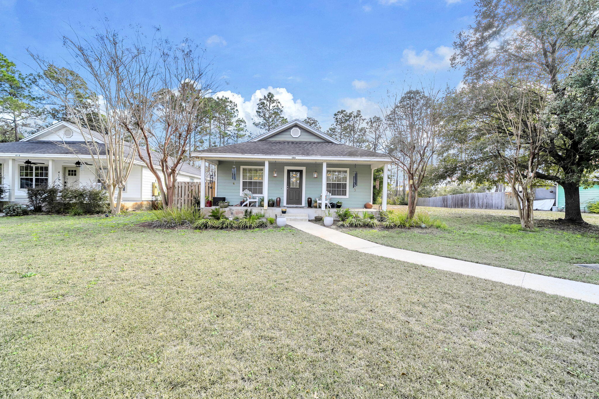 386 Hunters Road Santa Rosa Beach, FL 32459 - Photo 3 of 35 a front view of house with yard and green space