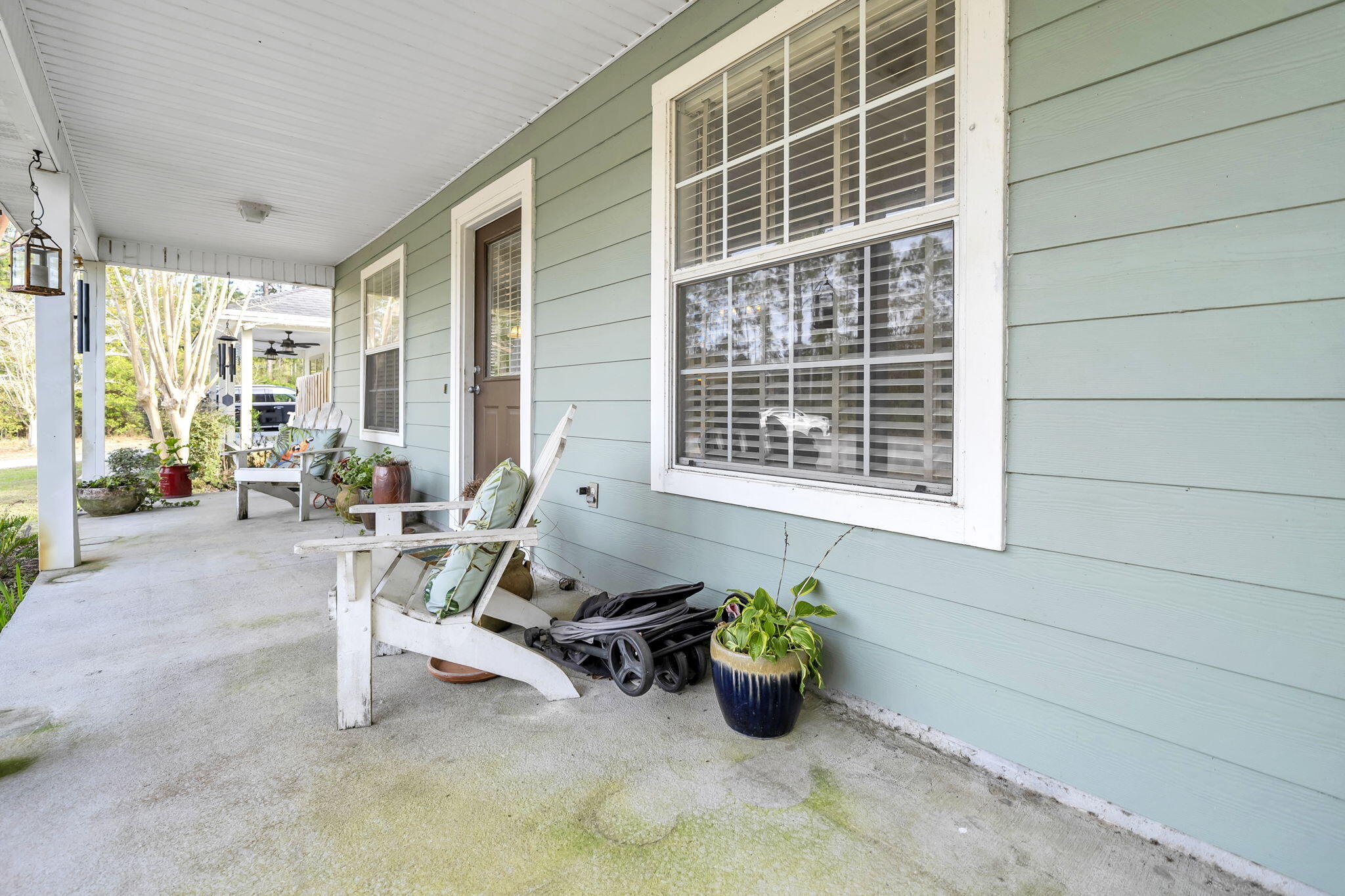 386 Hunters Road Santa Rosa Beach, FL 32459 - Photo 7 of 35 a view of a patio with dining table and chairs