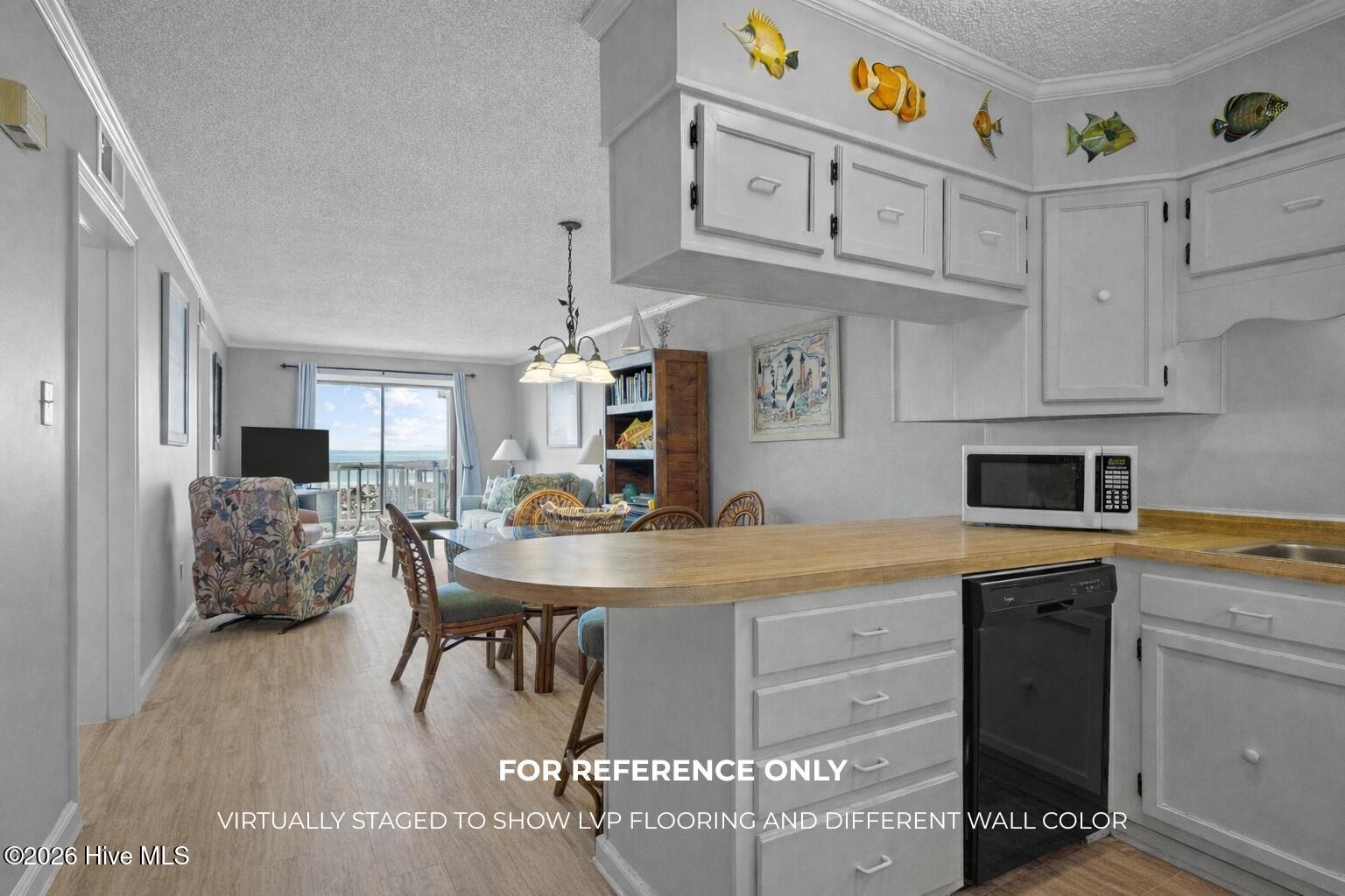 10300 Coast Guard Road, Unit A205 Emerald Isle, NC 28594 - Photo 10 of 46 *For reference only - virtually staged to show what condo could look like with LVP flooring and different color walls
