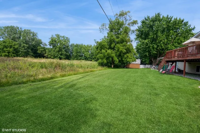 a view of outdoor space with playground and green space