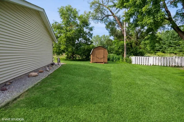 a view of a backyard with a small cabin