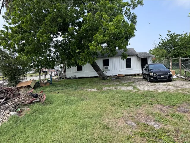 a house view with a garden space