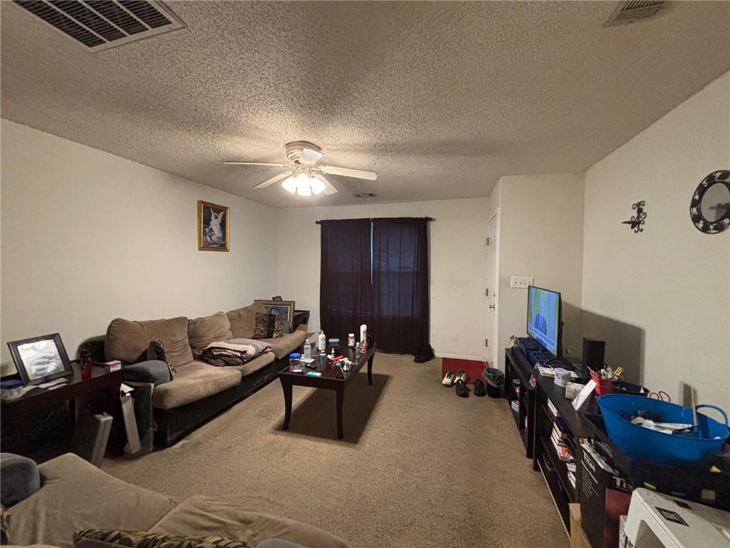 2361 River Ridge Road Northeast Milledgeville, GA 31061 - Photo 5 of 12 a living room with furniture a lamp and a flat screen tv