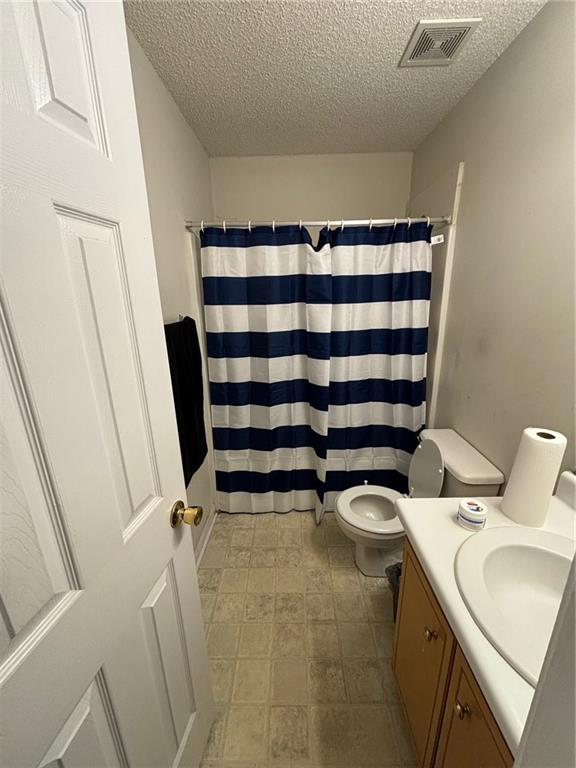 2361 River Ridge Road Northeast Milledgeville, GA 31061 - Photo 7 of 12 a bathroom with a sink and toilet