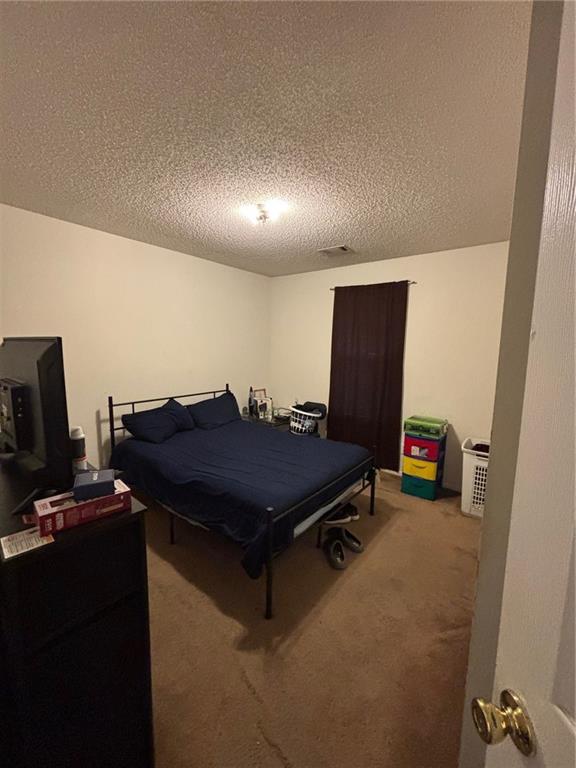 2361 River Ridge Road Northeast Milledgeville, GA 31061 - Photo 8 of 12 a room with furniture and a flat screen tv