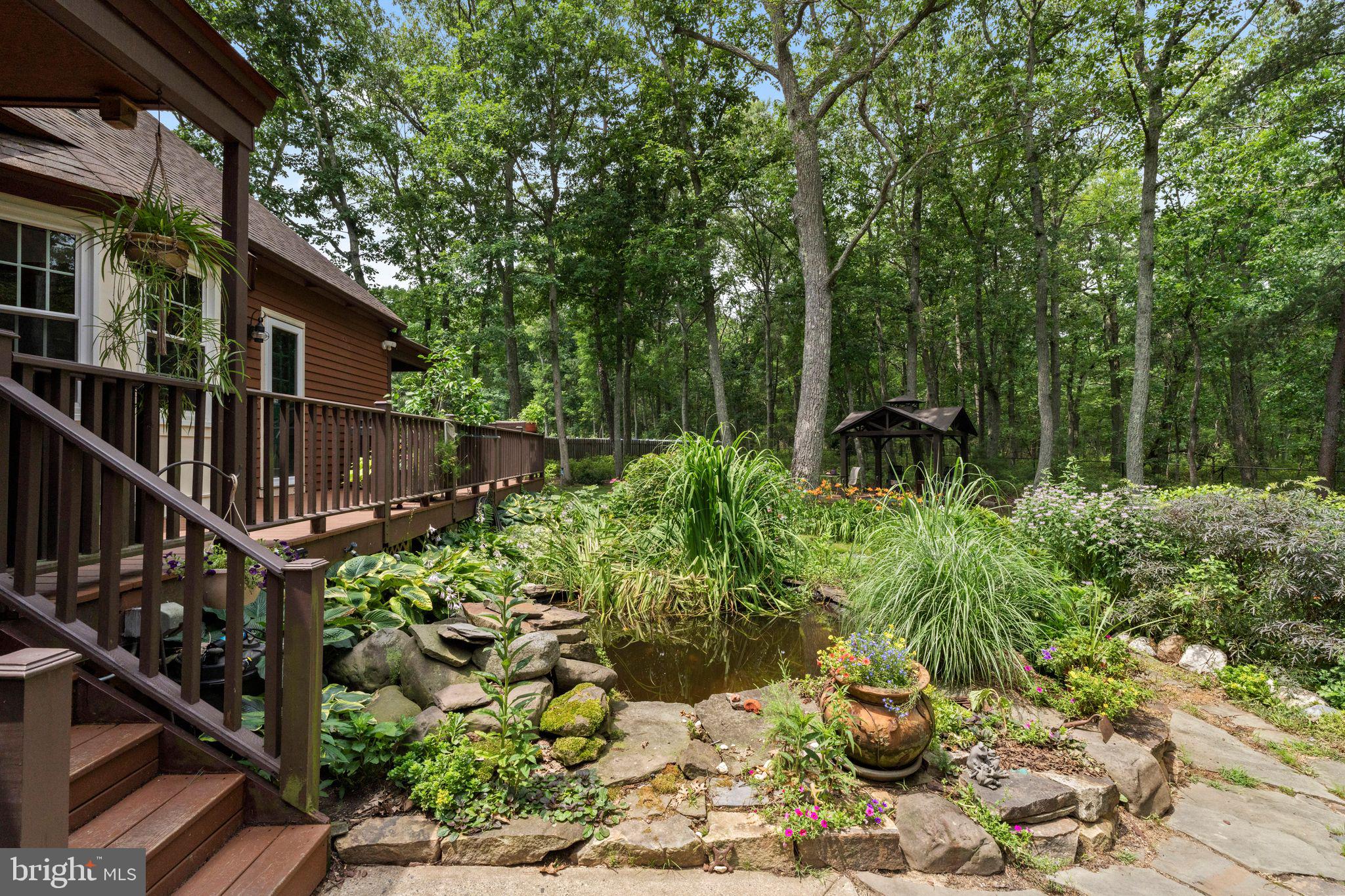 16 Dunhill Road Jackson, NJ 08527 - Photo 43 of 44 Serene garden retreat in lush woods.