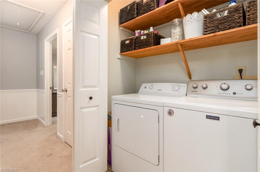 2453 Willard Road High Point, NC 27265 - Photo 24 of 29 Washer and dryer neatly tucked behind hallway doors.