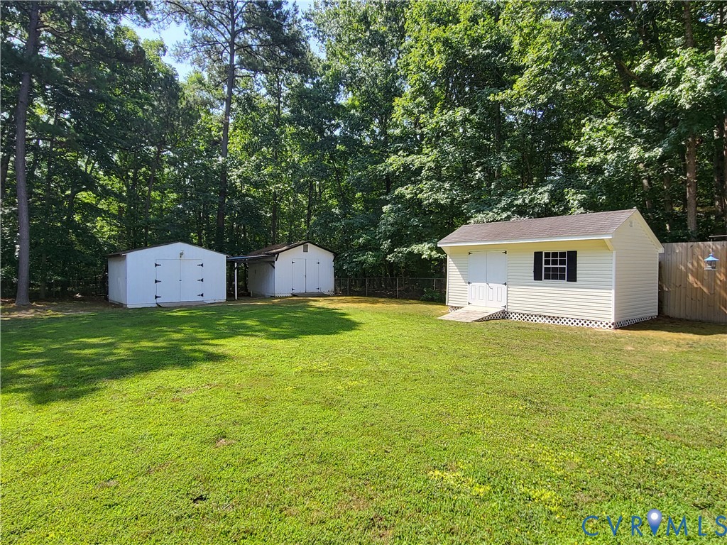 13521 Bailey Bridge Road Midlothian, VA 23112 - Photo 6 of 9 Expansive lawn with multiple outbuildings, includi