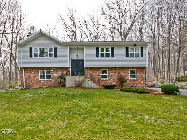 61 Old Dike Road Trumbull, CT 06611 - Photo 1 of 1 a front view of a house with a garden