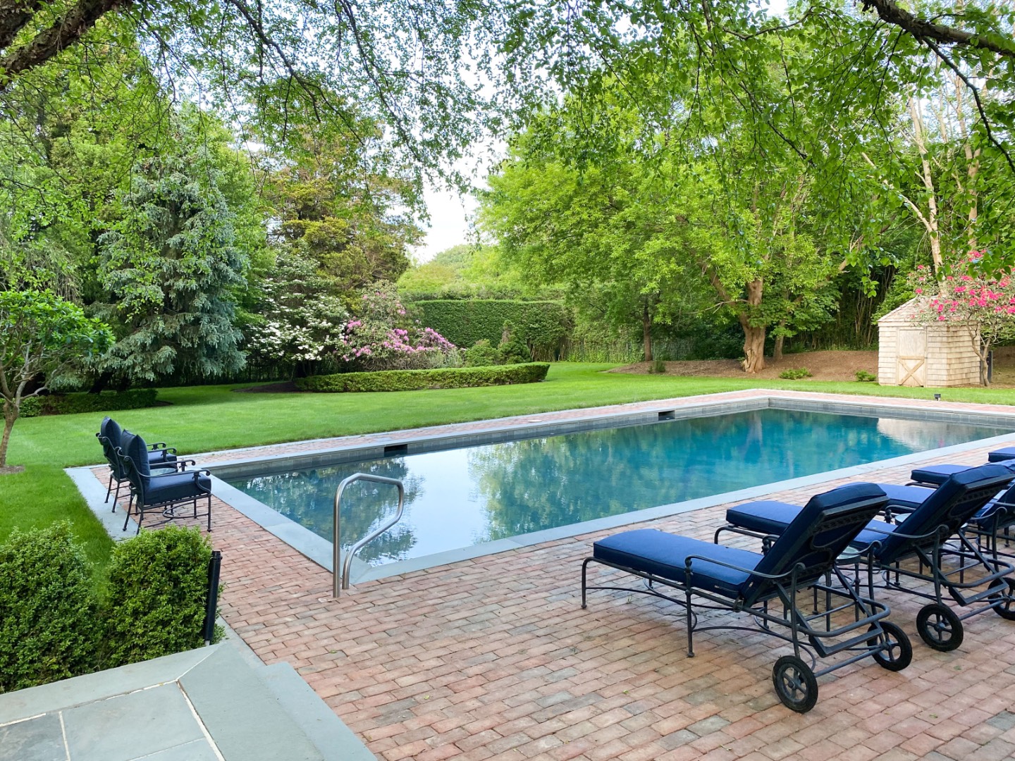 16 Amy's Lane East Hampton, NY 11937 - Photo 17 of 17 a view of a lake with a table and chairs