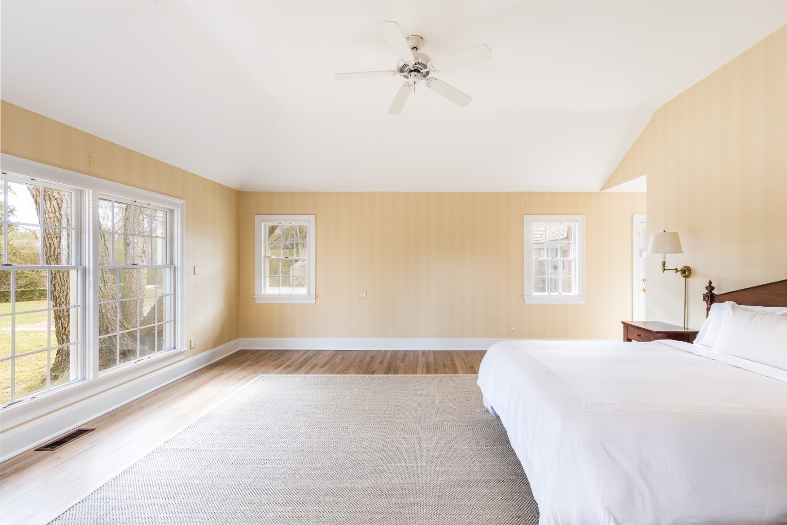 16 Amy's Lane East Hampton, NY 11937 - Photo 7 of 17 a bedroom with a large bed and a large window