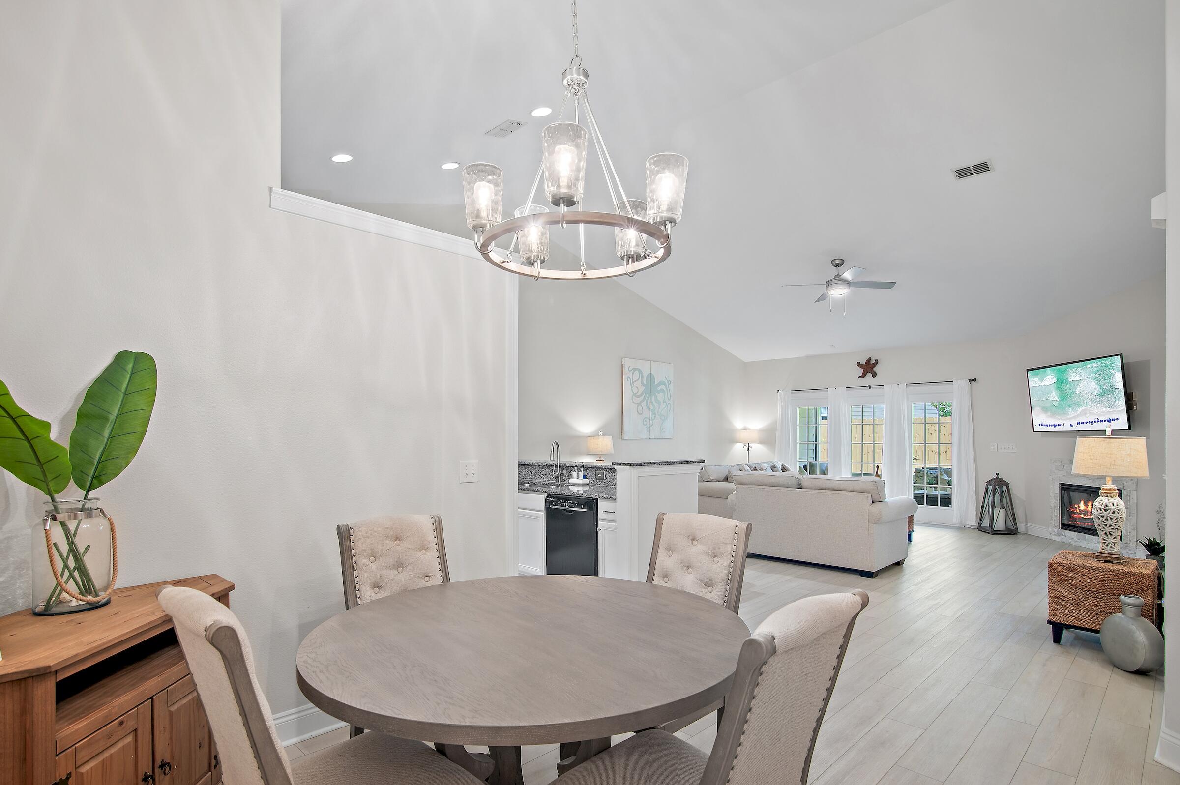 4202 Jade Loop Destin, FL 32541 - Photo 9 of 29 a view of a dining room with furniture and wooden floor