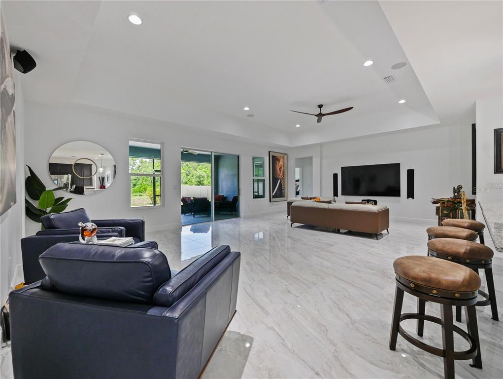 5264 Obsidian Gate Road Mount Dora, FL 32757 - Photo 18 of 49 a living room with furniture and a flat screen tv