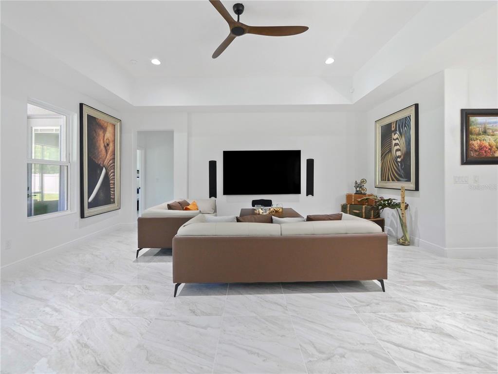 5264 Obsidian Gate Road Mount Dora, FL 32757 - Photo 21 of 49 a living room with furniture and a flat screen tv