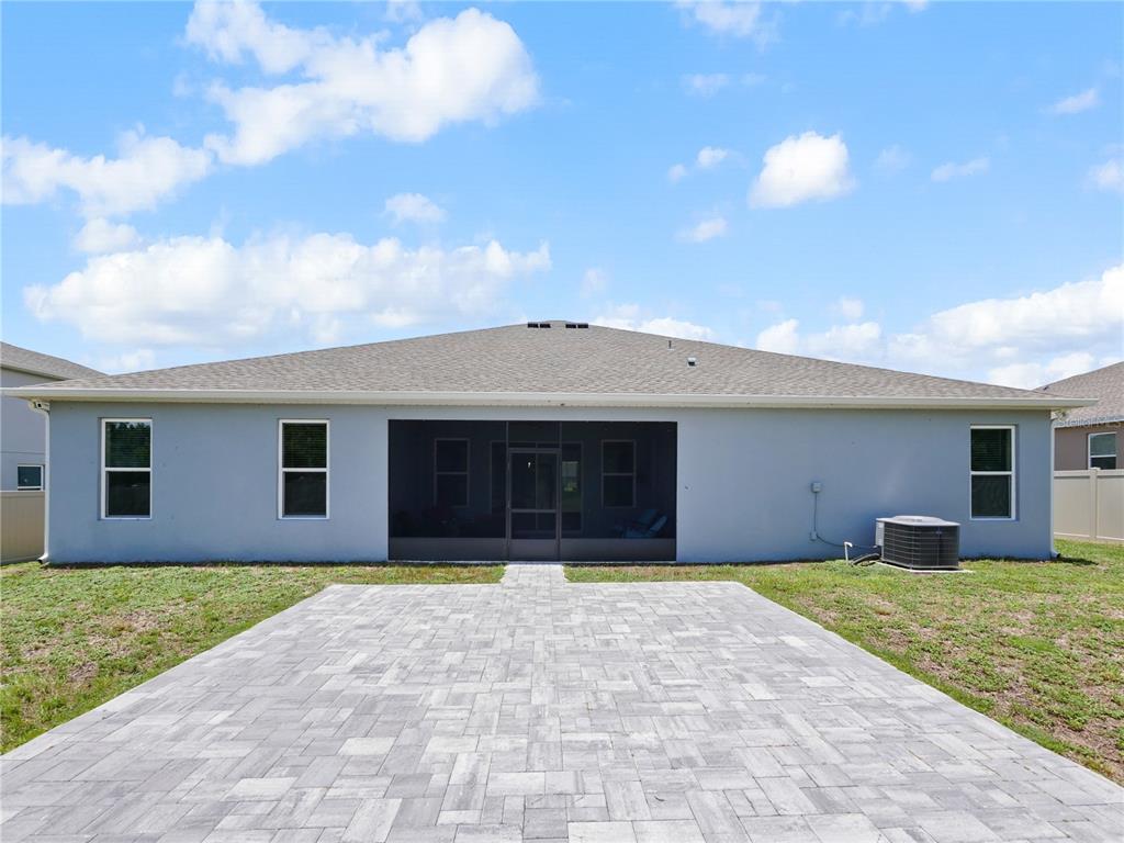 5264 Obsidian Gate Road Mount Dora, FL 32757 - Photo 37 of 49 a front view of house with yard and trees