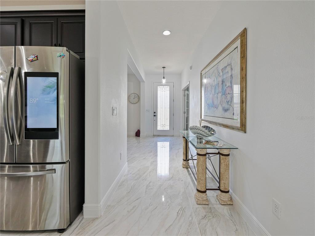 5264 Obsidian Gate Road Mount Dora, FL 32757 - Photo 10 of 49 a view of kitchen with furniture and wooden floor