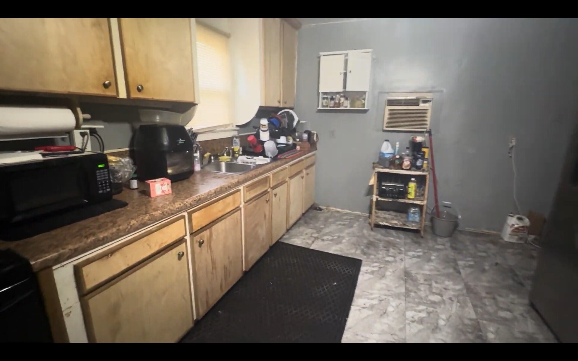 2503 Milwaukee Street Houston, TX 77026 - Photo 5 of 11 a kitchen with stainless steel appliances a sink and cabinets