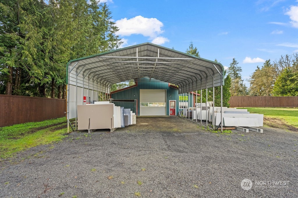 16731 Sargent Road Southwest Rochester, WA 98579 - Photo 23 of 34 a view of a house with a yard and roof