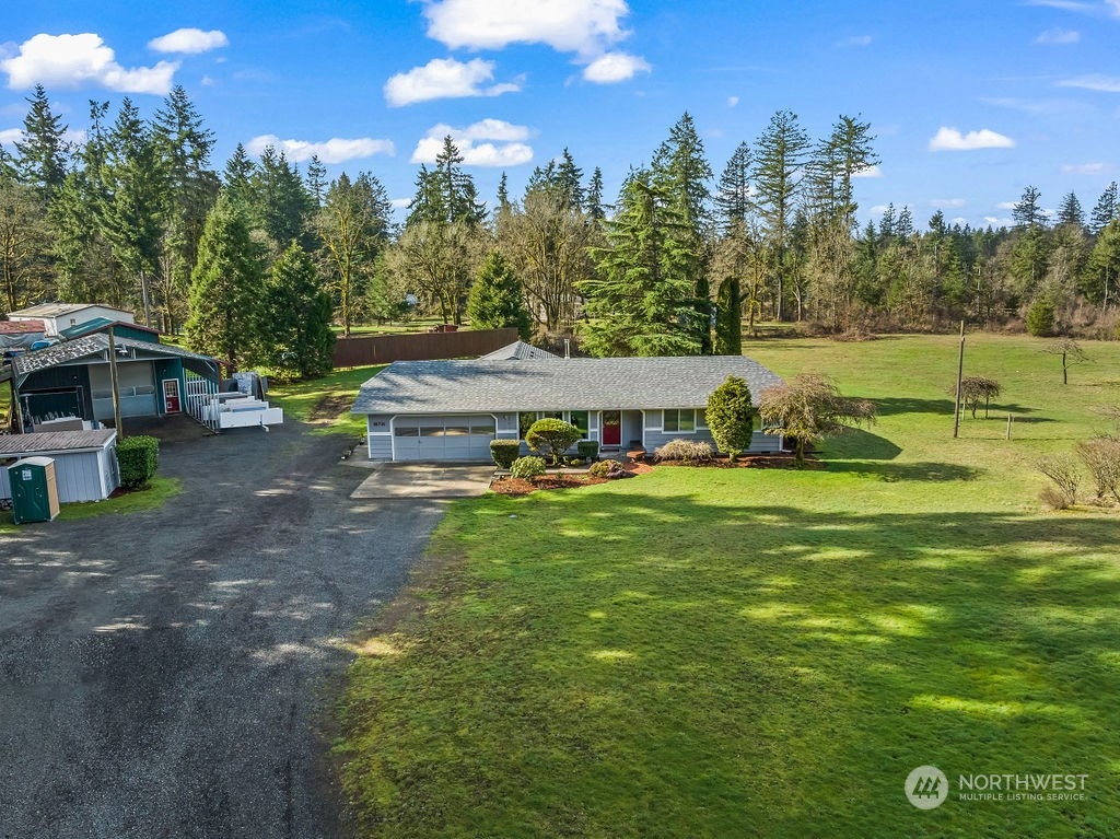 16731 Sargent Road Southwest Rochester, WA 98579 - Photo 33 of 34 a view of a house with a yard