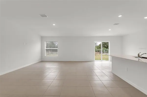 a kitchen with a sink a stove a microwave and cabinets