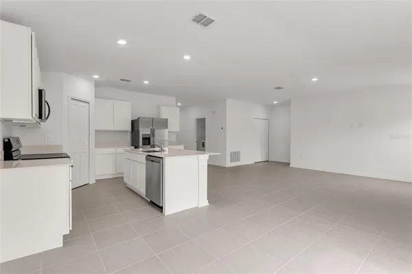 a view of an empty room with a sink