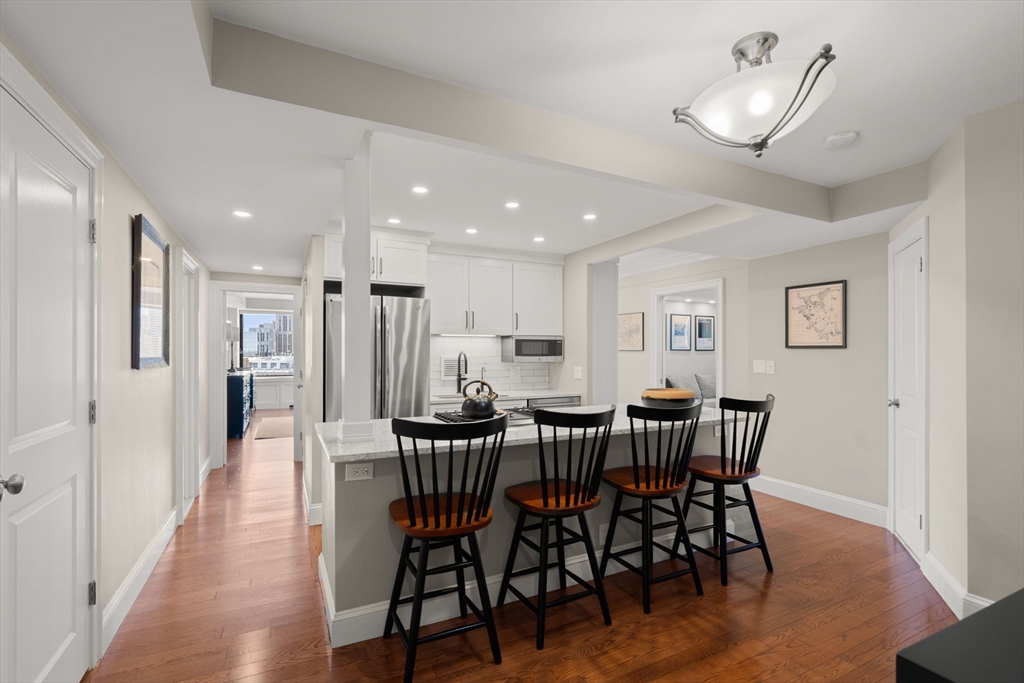 85 East India Row, Unit 20G Boston, MA 02110 - Photo 1 of 37 a view of a dining room with furniture