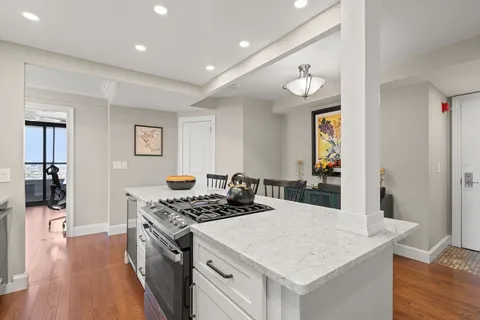 a kitchen with a stove a sink and a refrigerator