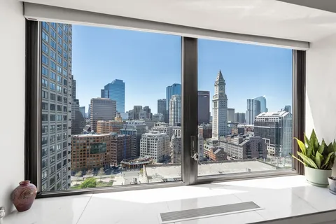 a view of a city from a living room