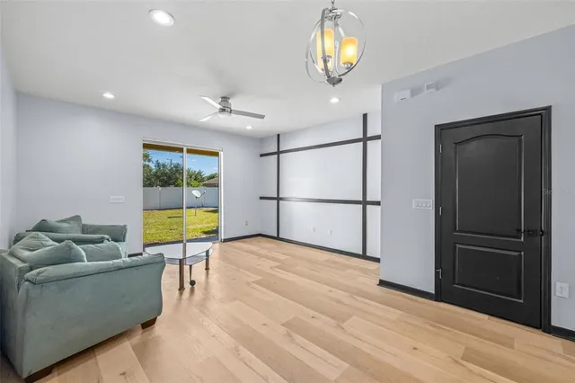 a view of livingroom with furniture and floor to ceiling window
