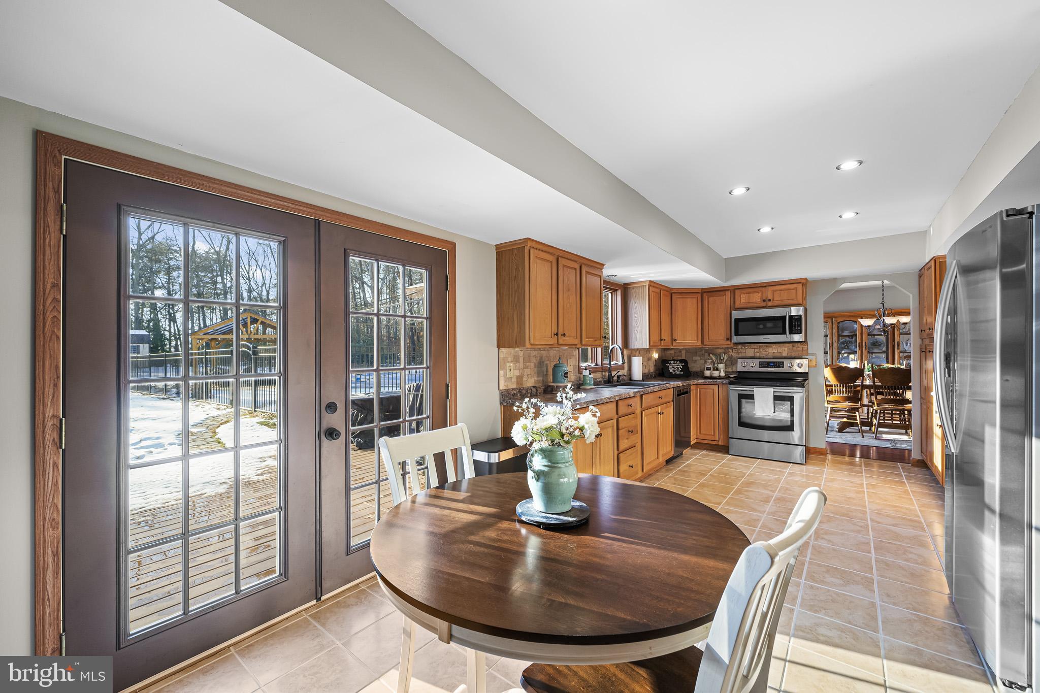 7365 Simms Landing Road Port Tobacco, MD 20677 - Photo 20 of 53 Breakfast area w/ doors leading to patio