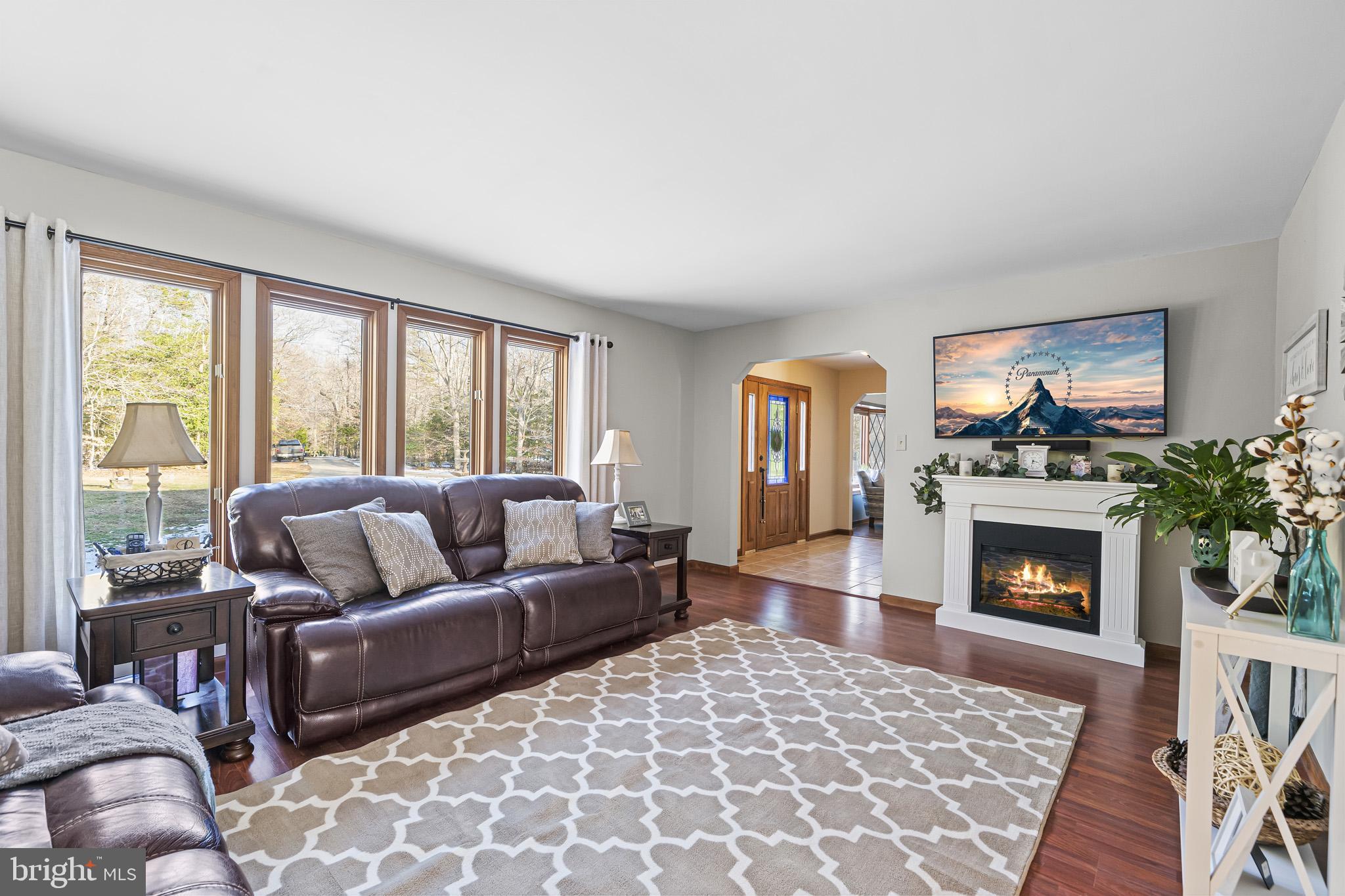 7365 Simms Landing Road Port Tobacco, MD 20677 - Photo 8 of 53 Living room off foyer w/ electric fireplace