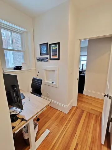 a room with furniture and wooden floor
