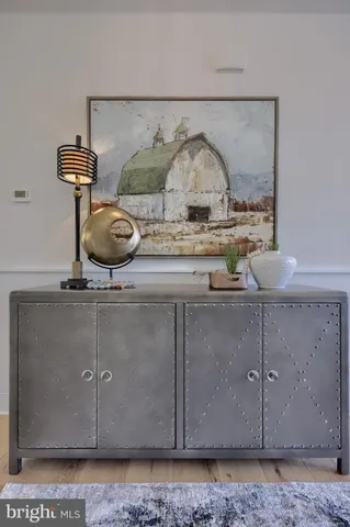 a spacious bathroom with a granite countertop sink and a mirror