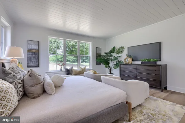 a kitchen with stainless steel appliances granite countertop a sink stove and white cabinets