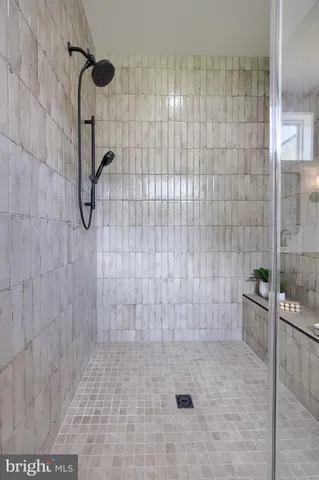 a living room with furniture potted plant and a fireplace